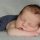 newborn boy sleeping on tummy